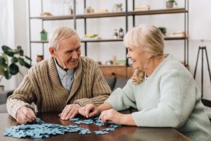 man talking to woman about the signs its time for memory care