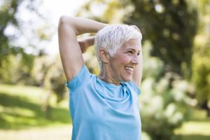 a woman exercising & practicing healthy habits for seniors