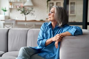 a woman enjoys peaceful me time in a senior living home