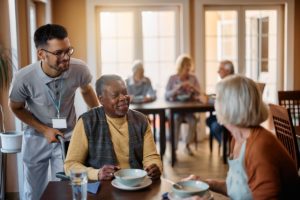 seniors socialize while receiving professional care and support in an assisted living facility