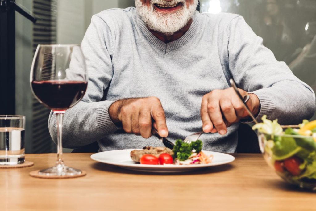 an elderly man enjoys a nutritious and heart healthy meal