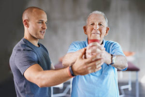 an elderly man sees his health and wellness greatly improve thanks to a physical therapy program