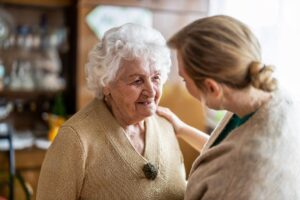 Woman talks to patient about the benefits of respite care