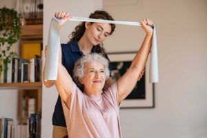 Senior does arm strength exercise in Houston senior physical therapy