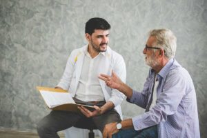 Senior talks to doctor about signs a senior needs speech therapy
